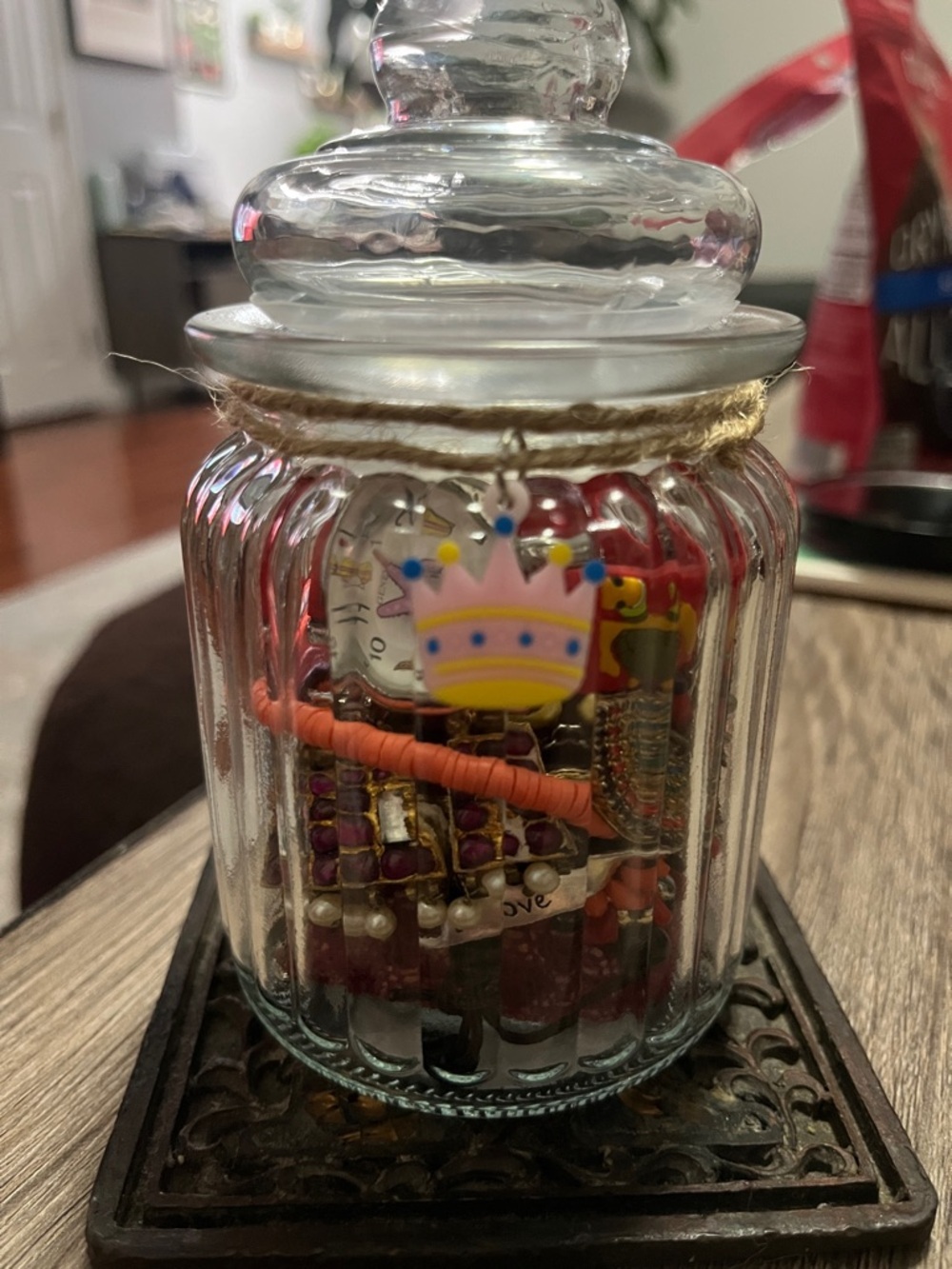 Jar Filled with red tone jewelry